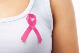 How does menstrual and reproductive history affect breast cancer risks?